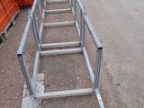 a ladder that has been placed on the side of the road