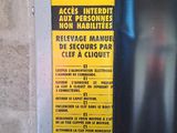 a sign on the door of a building that warns people not to use the elevator