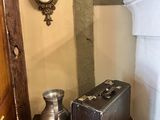 two suitcases sitting on a table next to a clock