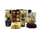 many different types of liquors and bottles on the table