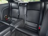 the back seats of a car with a speaker in the center