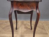 an old wooden table with a drawer on top of it