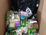 a cardboard box filled with lots of food and a clock