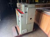 a machine that is sitting on a pallet in a garage