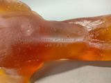 a close up of a gummy dog bone on a table