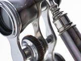 a close up of a person holding a pair of binoculars