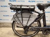a bicycle with a basket on the back of it