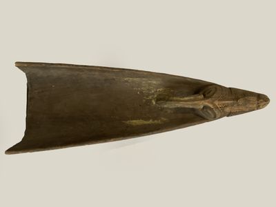 a close up of a metal object on a white surface