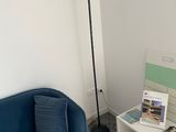 a blue couch and a table in a room