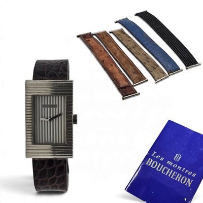 a picture of a watch, a book, and a book on a table
