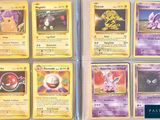 several pokemon cards are displayed on a table in front of each other