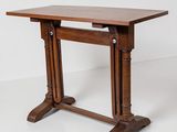 a wooden table with two legs and a wooden top
