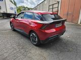 the rear end of a red honda civic hatchback parked in a parking lot