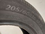 a close up of a tire on a white surface
