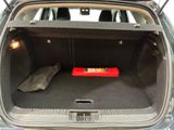 a trunk of a car with a red box in the trunk