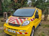 a yellow van that is parked in the grass