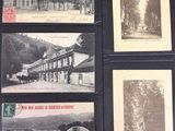 many old postcards of different types on a table