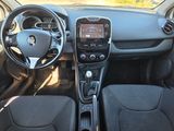 the interior of a car with a steering wheel and dashboard controls