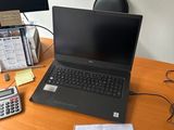 a laptop computer sitting on top of a wooden desk