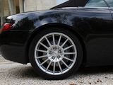 a black sports car parked in front of a building