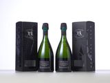 two bottles of champagne in front of a black box