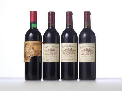 three bottles of wine are lined up on a table
