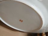 a white cup and saucer sitting on a table
