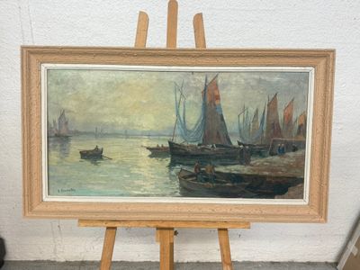 une photo d'un tableau posé sur un chevalet au bord de l'eau