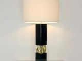 a lamp that is sitting on a table with a lamp on it
