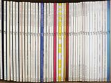 a lot of books that are stacked together on a shelf