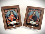two framed pictures of jesus and mary on a white background