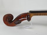 an old violin with a wooden back and a black bow