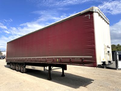 a semi trailer that is parked in a parking lot