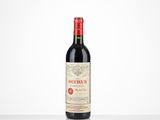 a bottle of red wine sitting on top of a table