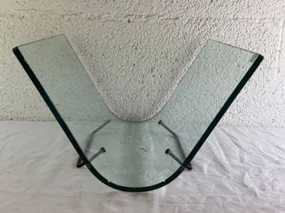 a glass vase that is on a white table