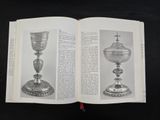a book open to a page with a picture of a silver goblet on it