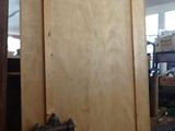 a picture of a large wooden door in a room