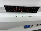a close up of a sticker on the front of a white car