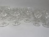 a lot of empty wine glasses on the table