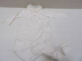 a white babysuit with a ruffled collar on it