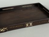 an image of a wooden tray with writing on it on a table