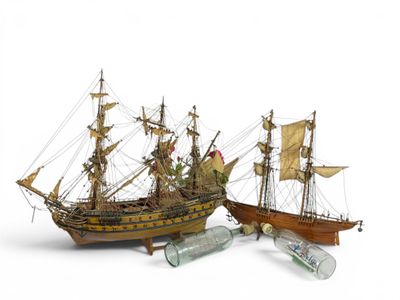 two model ships that are sitting next to each other