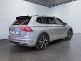 the rear end of a silver volkswagen suv parked in a garage