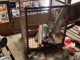 a cage with a bird inside of it in a warehouse