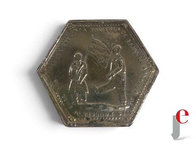 une pièce de monnaie en argent portant l'image d'un homme et d'une femme