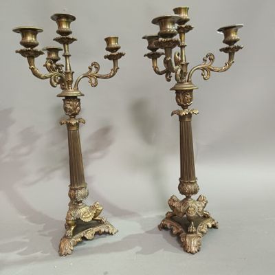 pair of antique brass candelabs with flowers and leaves
