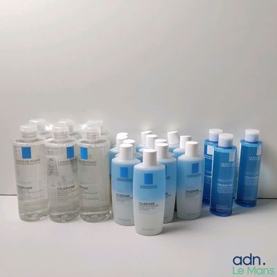 many bottles of lotion sitting on a table