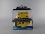a yellow van and a blue car in a display case