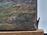a close up of a painting on a wooden stand