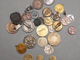 a lot of coins that are on the table